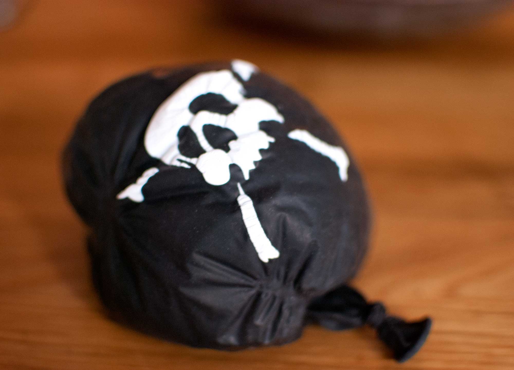 deflated scull and crossbones balloon