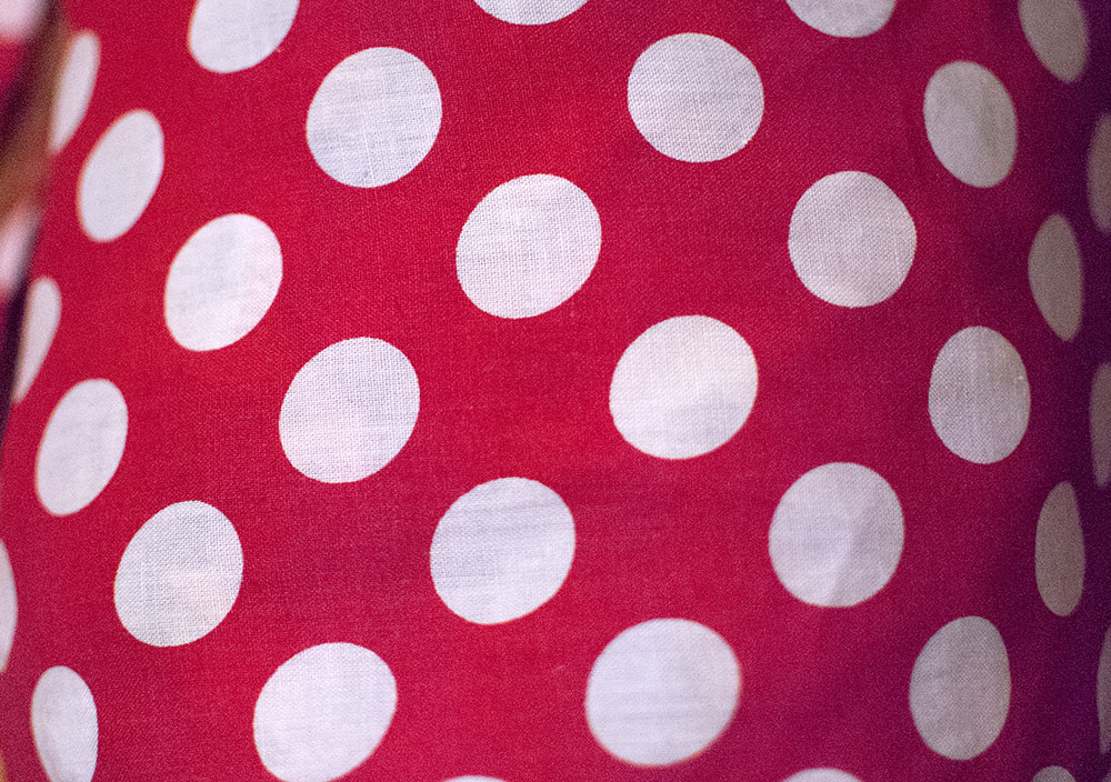 white polka dots on red